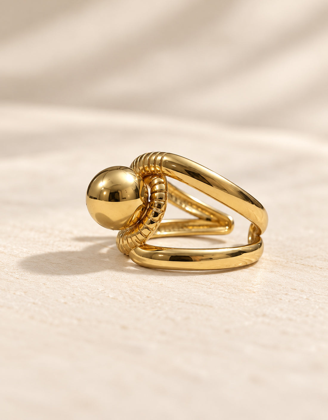 Orneza Gold-Tone Ball and Ribbed Loop Ring — angle view