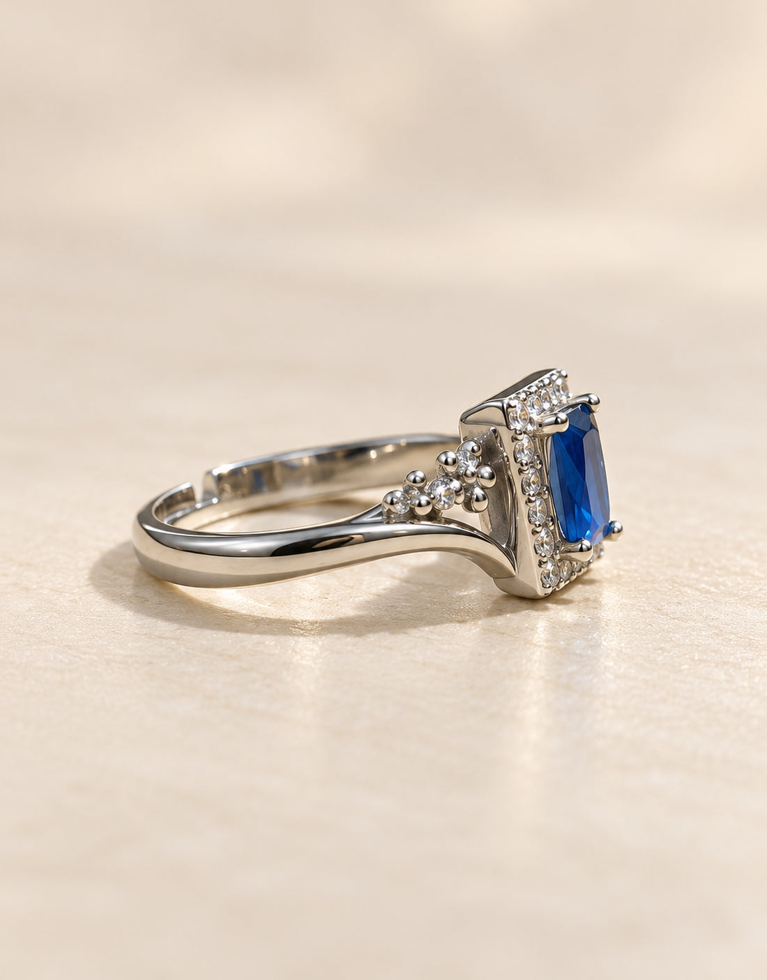 Orneza Silver-Tone Blue Rectangle Halo Ring — angle view