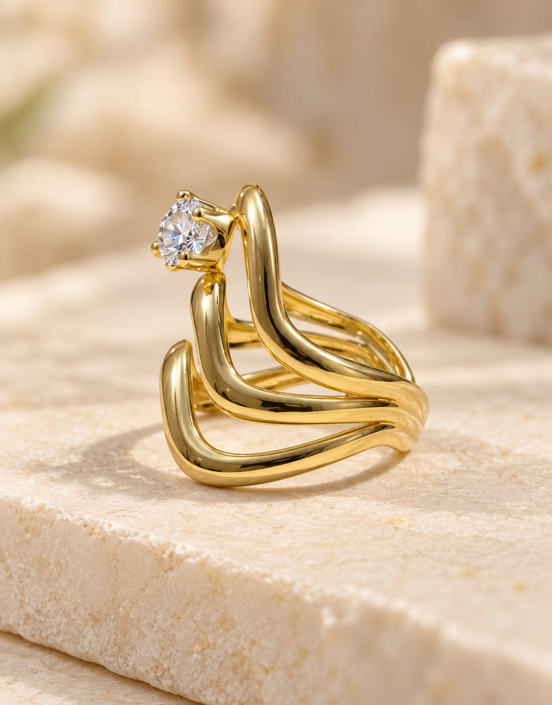 Orneza Gold-Tone Wavy Stacked Clear Stone Ring — angle view
