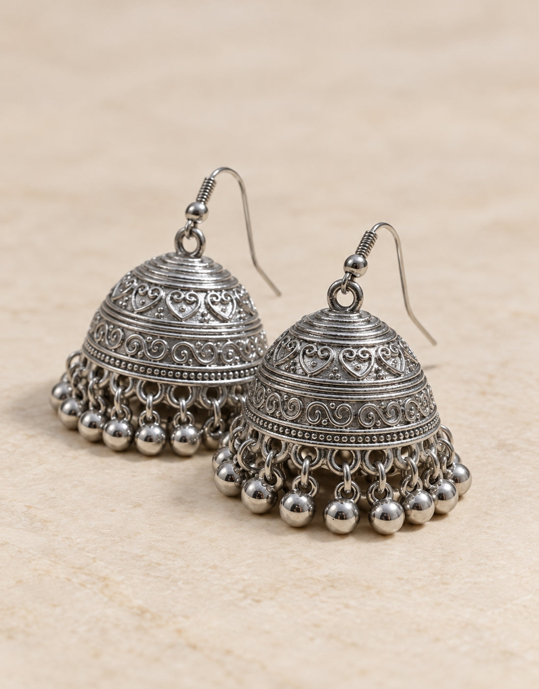 Orneza Silver-Tone Engraved Bell Jhumka Earrings — angle view