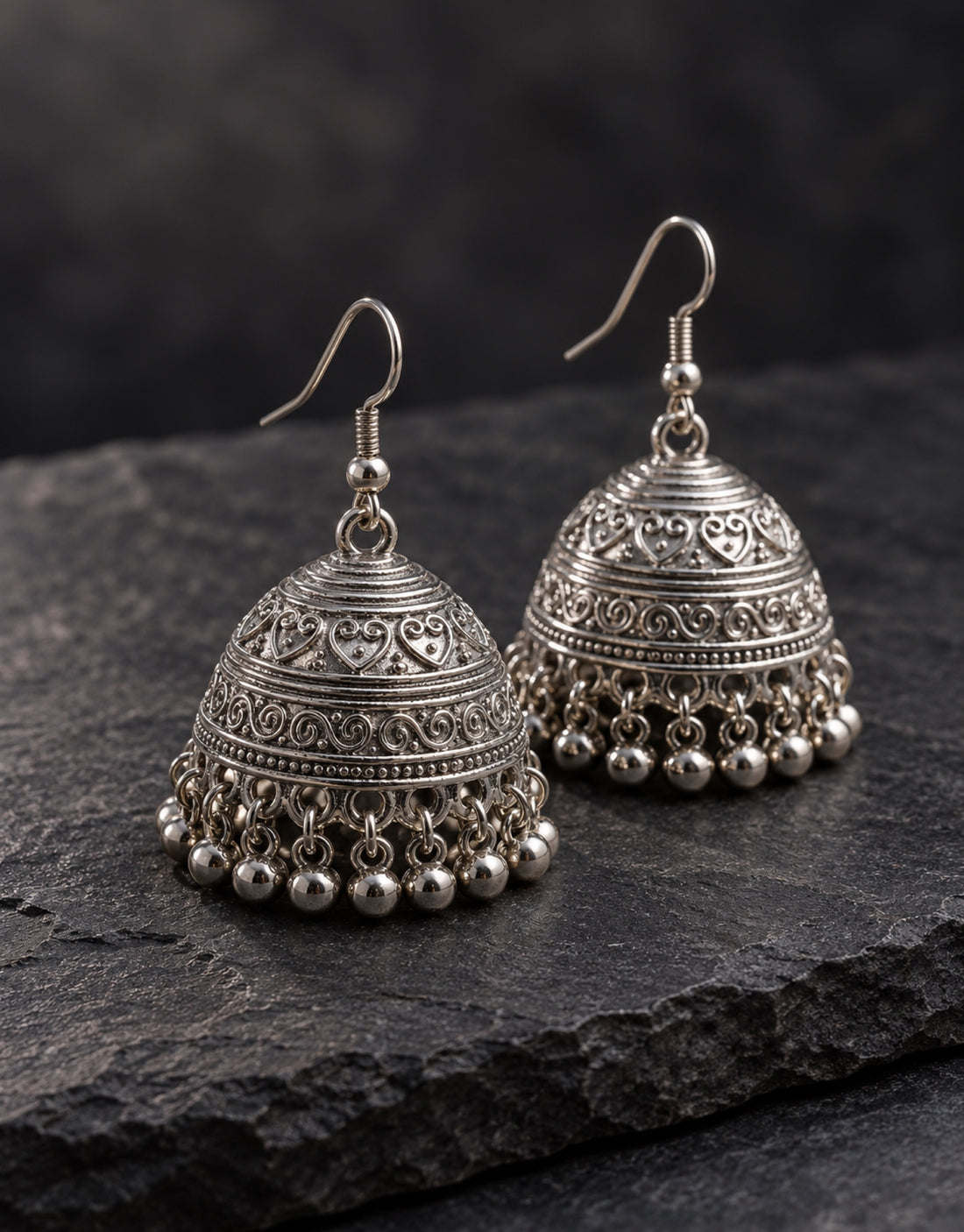Orneza Silver-Tone Engraved Bell Jhumka Earrings — styled view