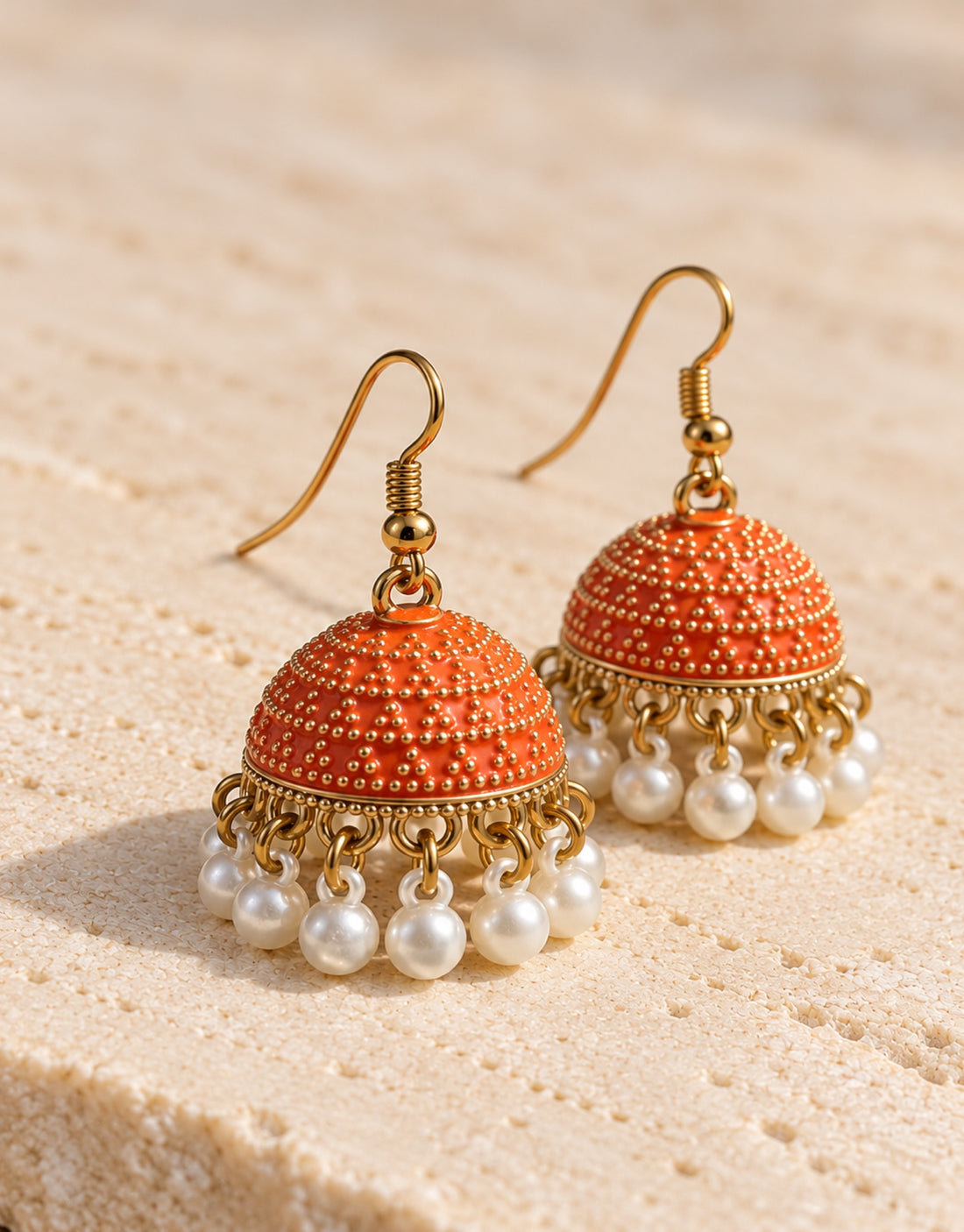 Orneza Orange Dotted Enamel Jhumka Earrings with Pearls — angle view