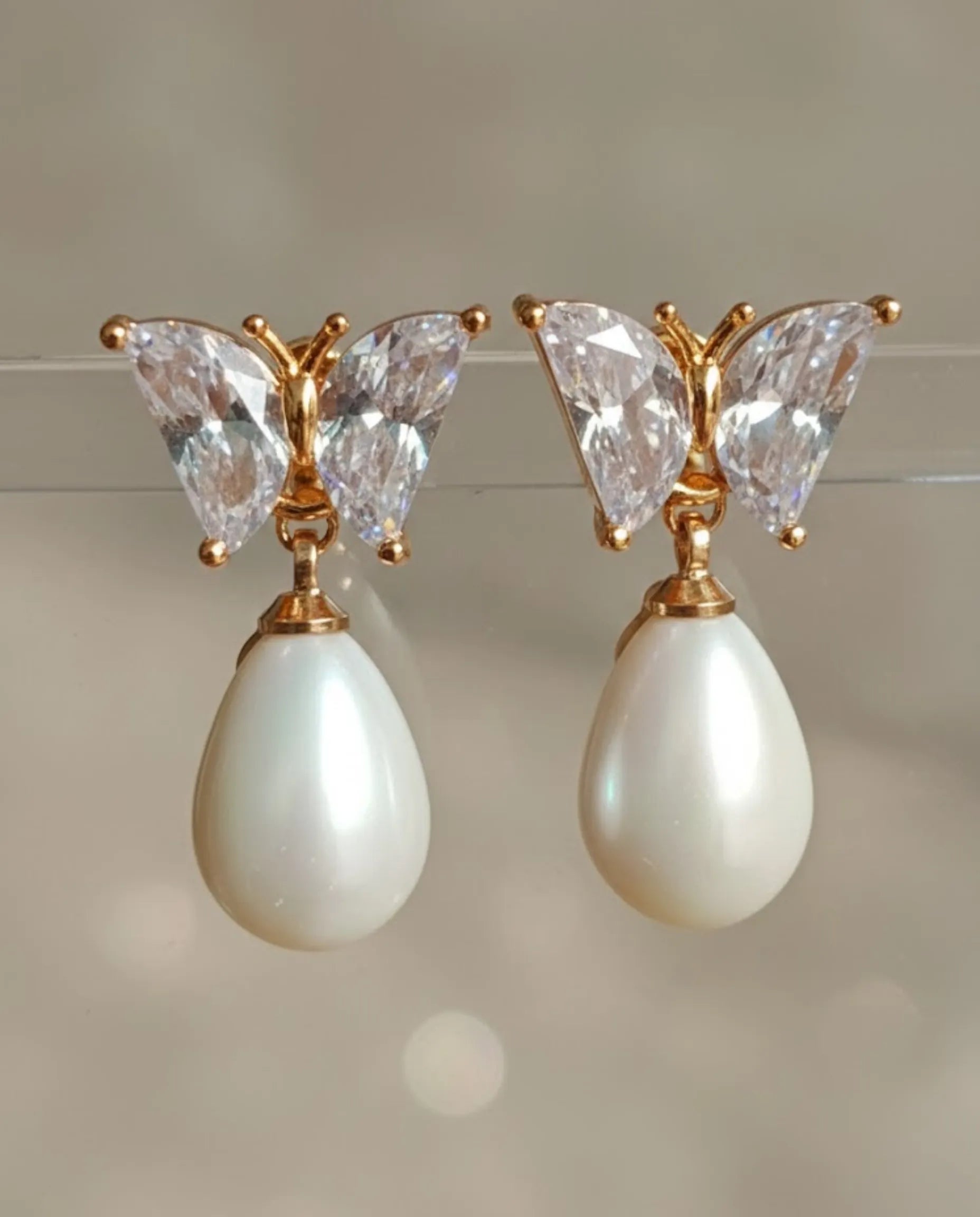 Orneza Crystal Butterfly Gold Drop Earrings with Teardrop Pearl