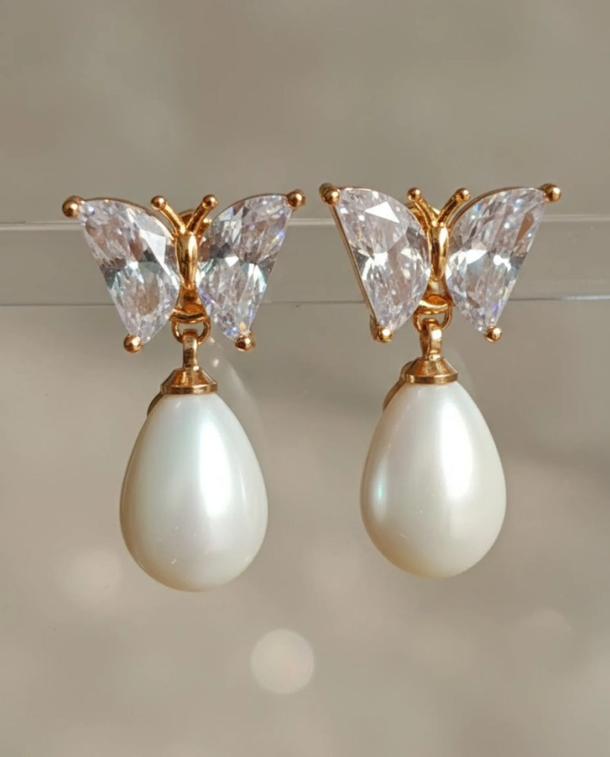 Orneza Crystal Butterfly Gold Drop Earrings with Teardrop Pearl