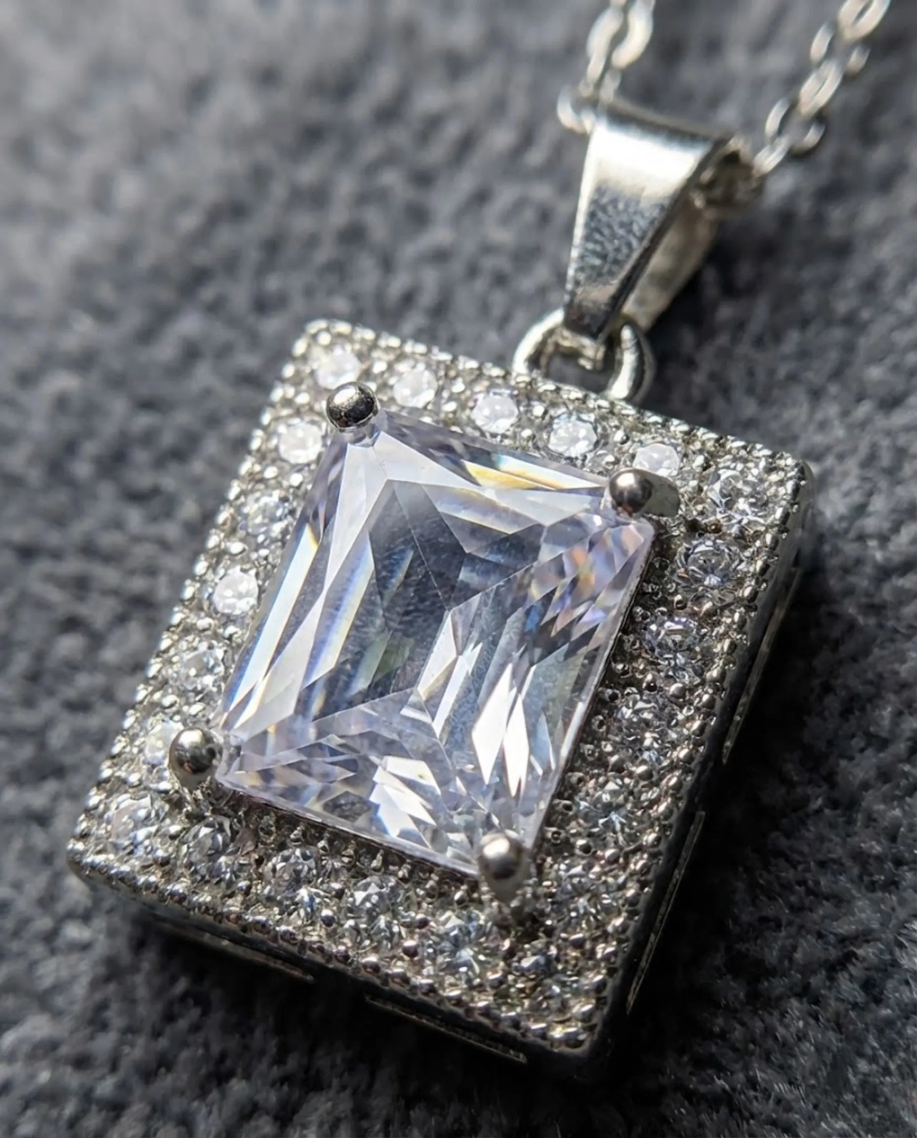 Orneza Silver Emerald Cut Zircon Halo Pendant Necklace