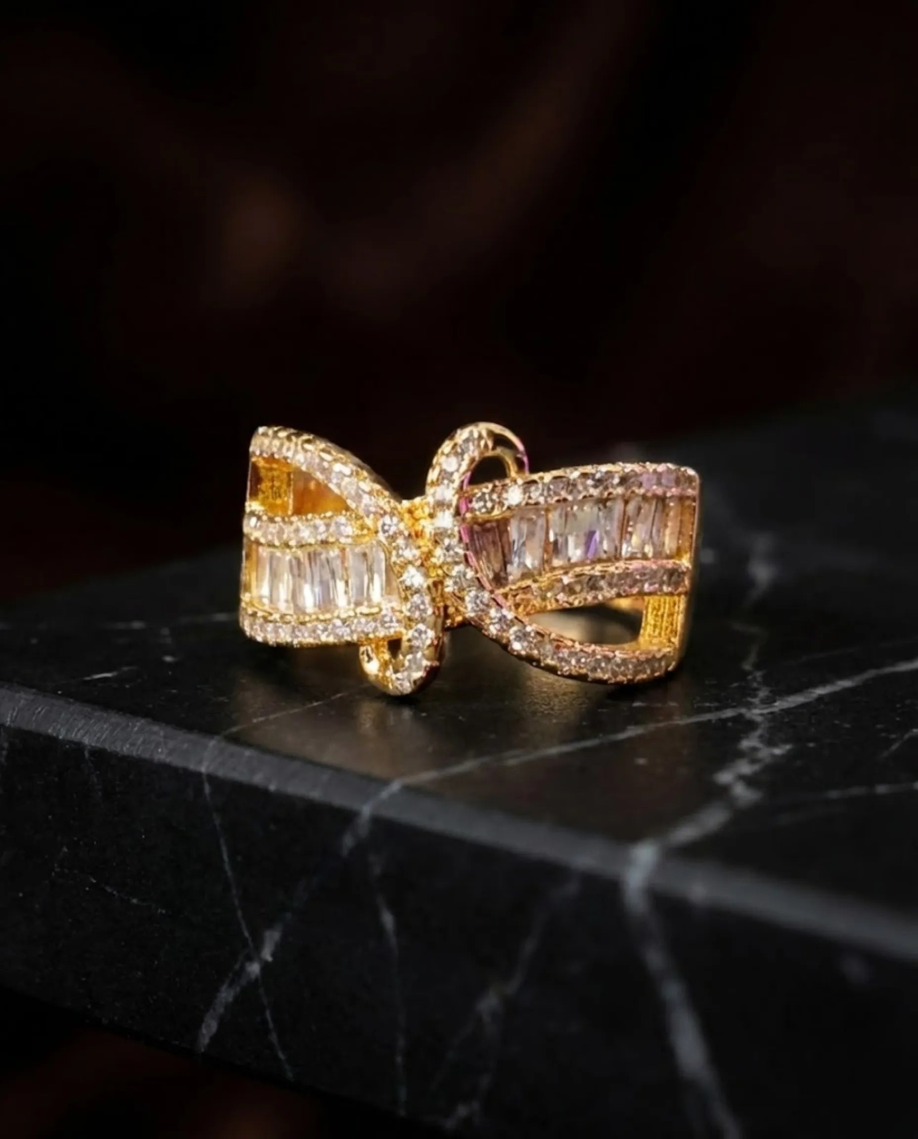 Orneza Gilded Bow Baguette Crystal Statement Ring