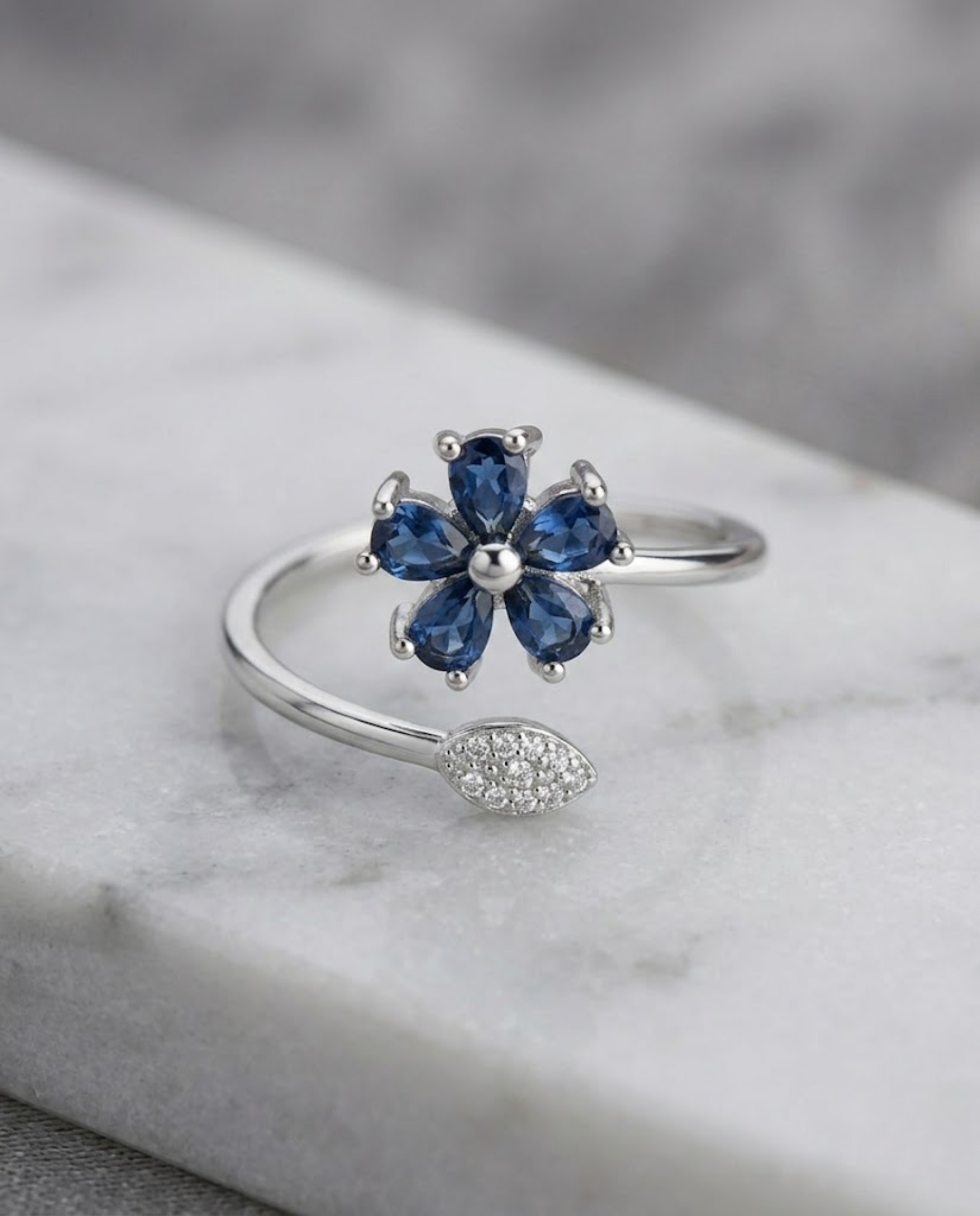 Orneza Sapphire Blue Floral Wrap Ring in Silver