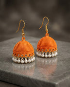 Orange Textured Jhumka Earrings with Elegant Pearl Drops