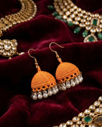 Orange Textured Jhumka Earrings with Elegant Pearl Drops
