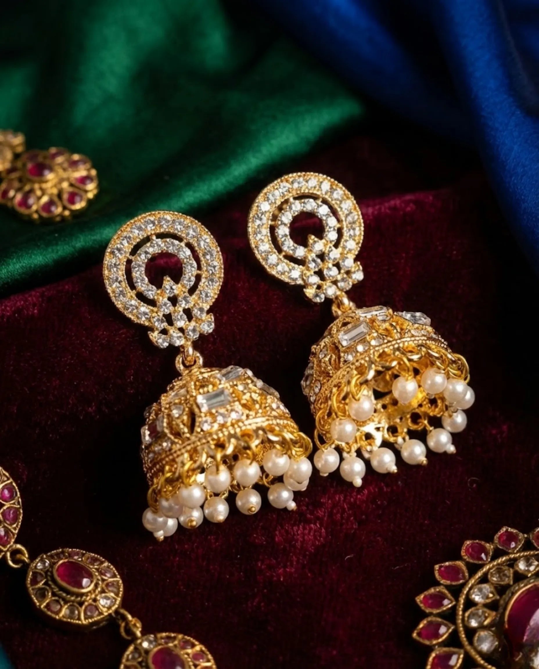 Orneza Gold Zircon Studded Jhumka Earrings with Pearls