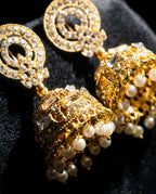 Orneza Gold Zircon Studded Jhumka Earrings with Pearls