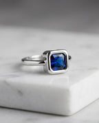 Orneza Royal Blue Sapphire Square Solitaire Silver Ring