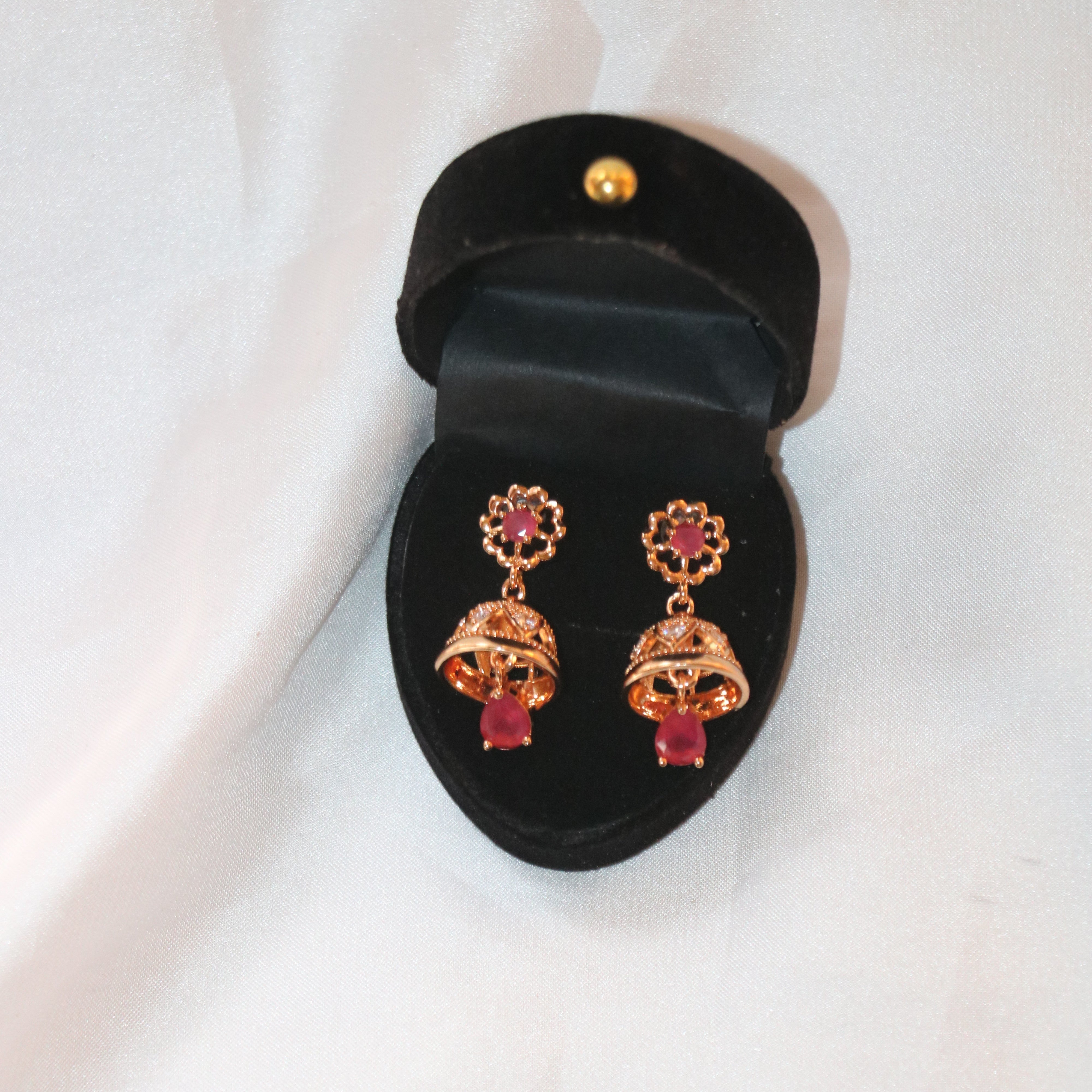 Gold-Plated Floral Jhumka Earrings with Ruby Red Accents – A Blend of Tradition and Elegance