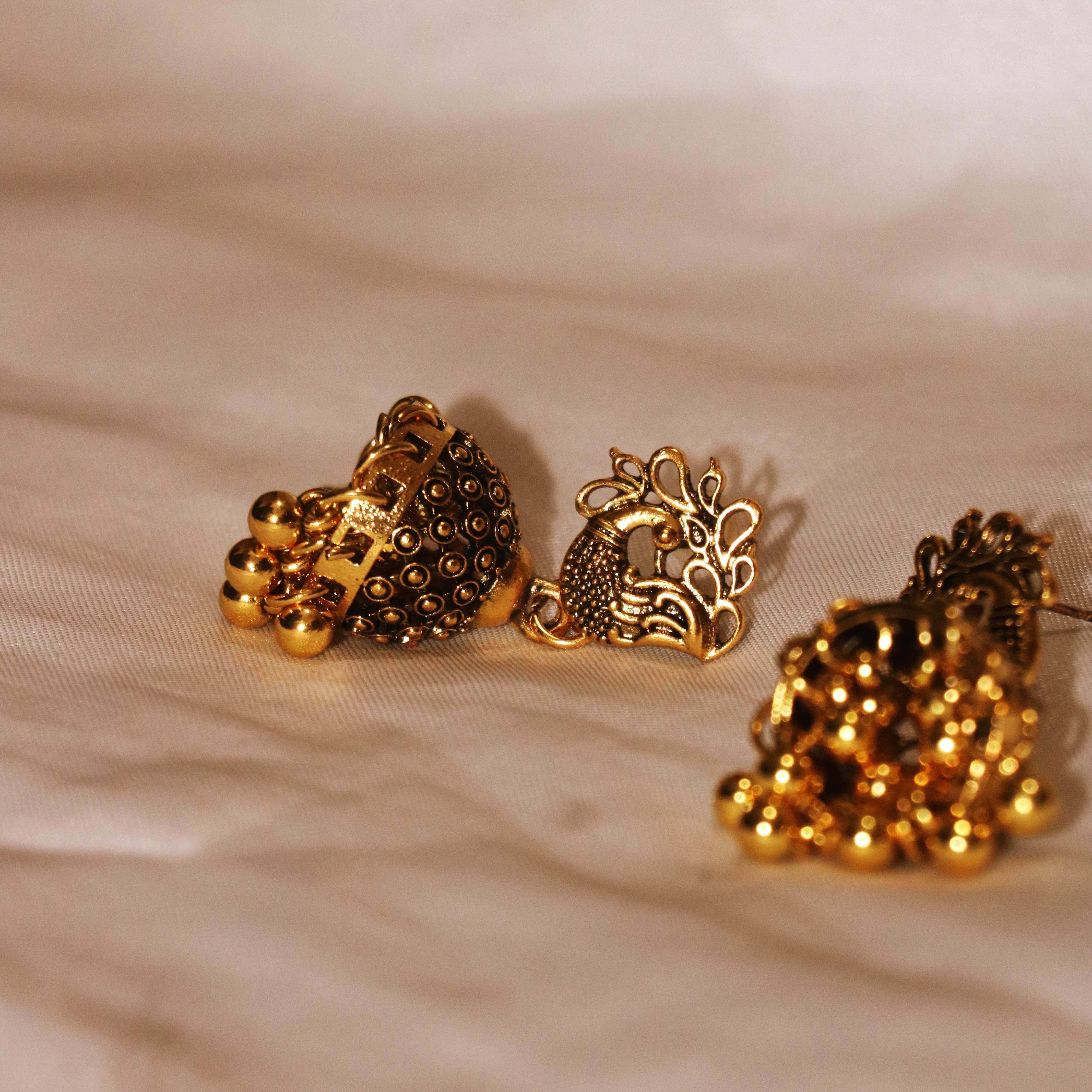 Golden Peacock Jhumka Earrings – Traditional Elegance Redefined