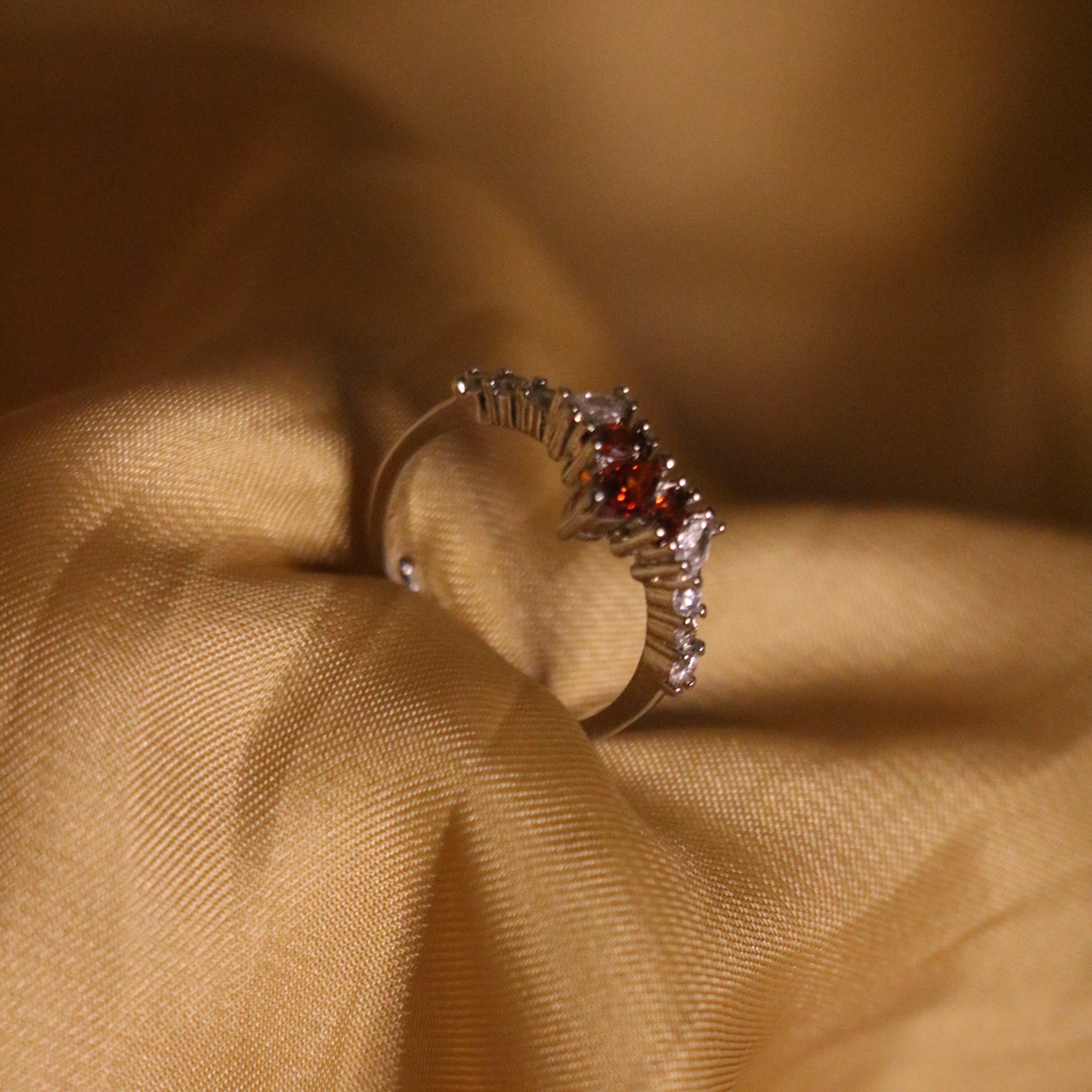 Royal Elegance: Silver Crown Ring with Radiant Red Gemstone