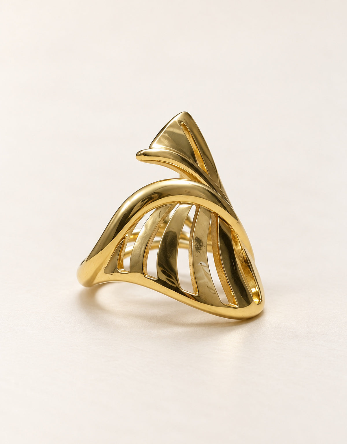 Orneza Gold-Tone Cutout Crossover Dome Ring — angle view