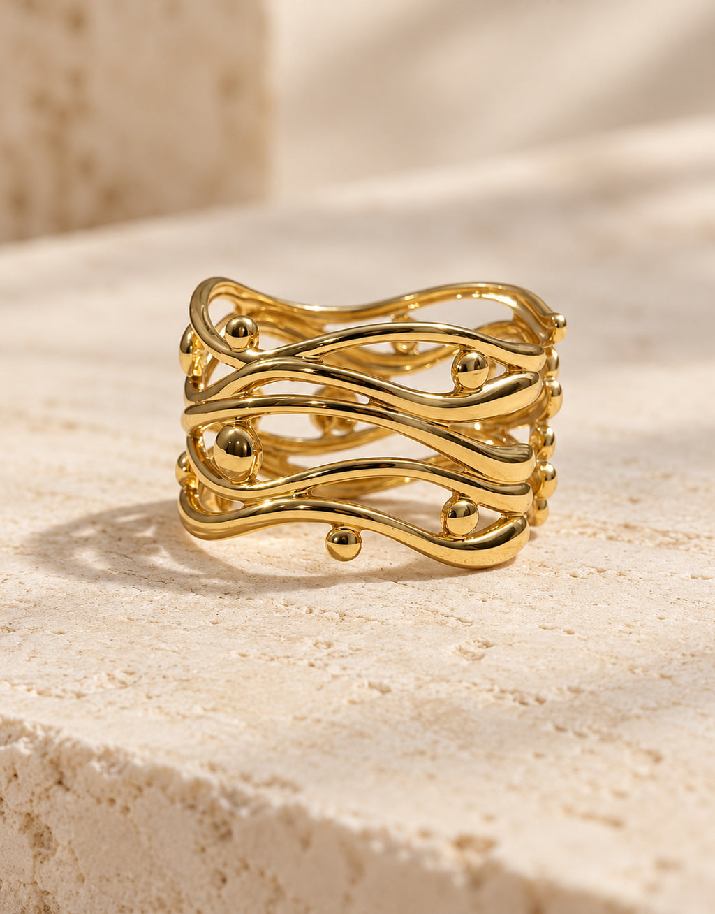 Orneza Gold-Tone Wavy Lattice Wide Ring — front view