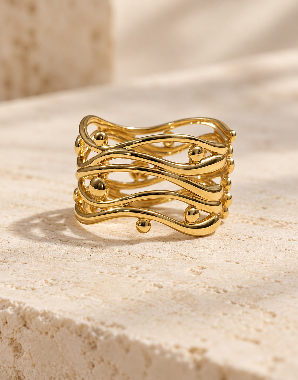 Orneza Gold-Tone Wavy Lattice Wide Ring — front view
