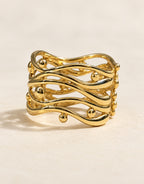 Orneza Gold-Tone Wavy Lattice Wide Ring — angle view