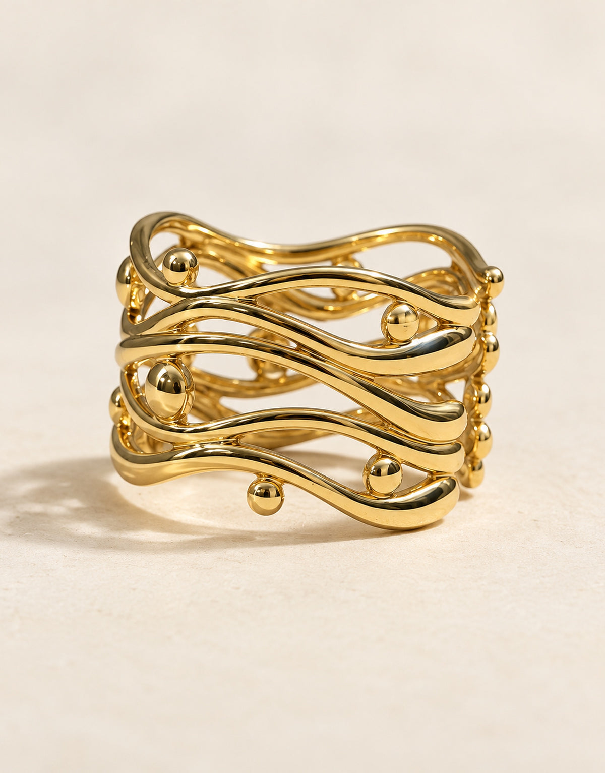 Orneza Gold-Tone Wavy Lattice Wide Ring — angle view