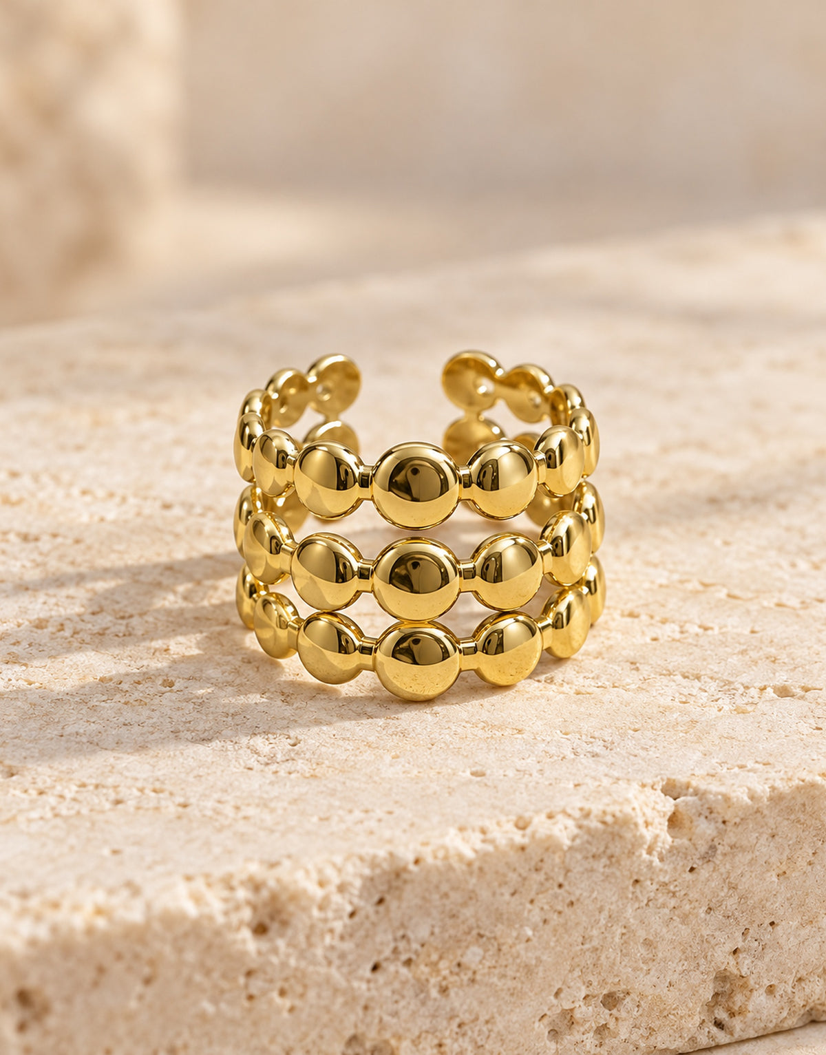 Orneza Gold-Tone Triple Row Disc Bead Ring — front view