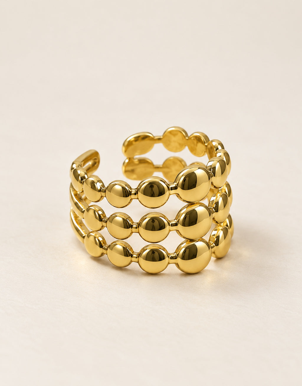 Orneza Gold-Tone Triple Row Disc Bead Ring — angle view