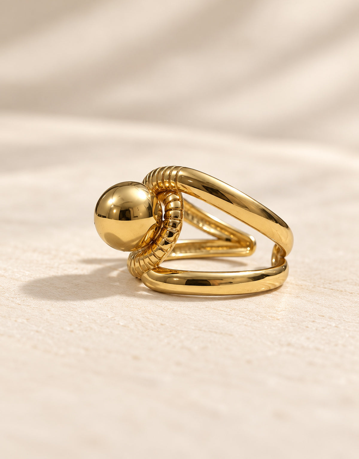 Orneza Gold-Tone Ball and Ribbed Loop Ring — angle view