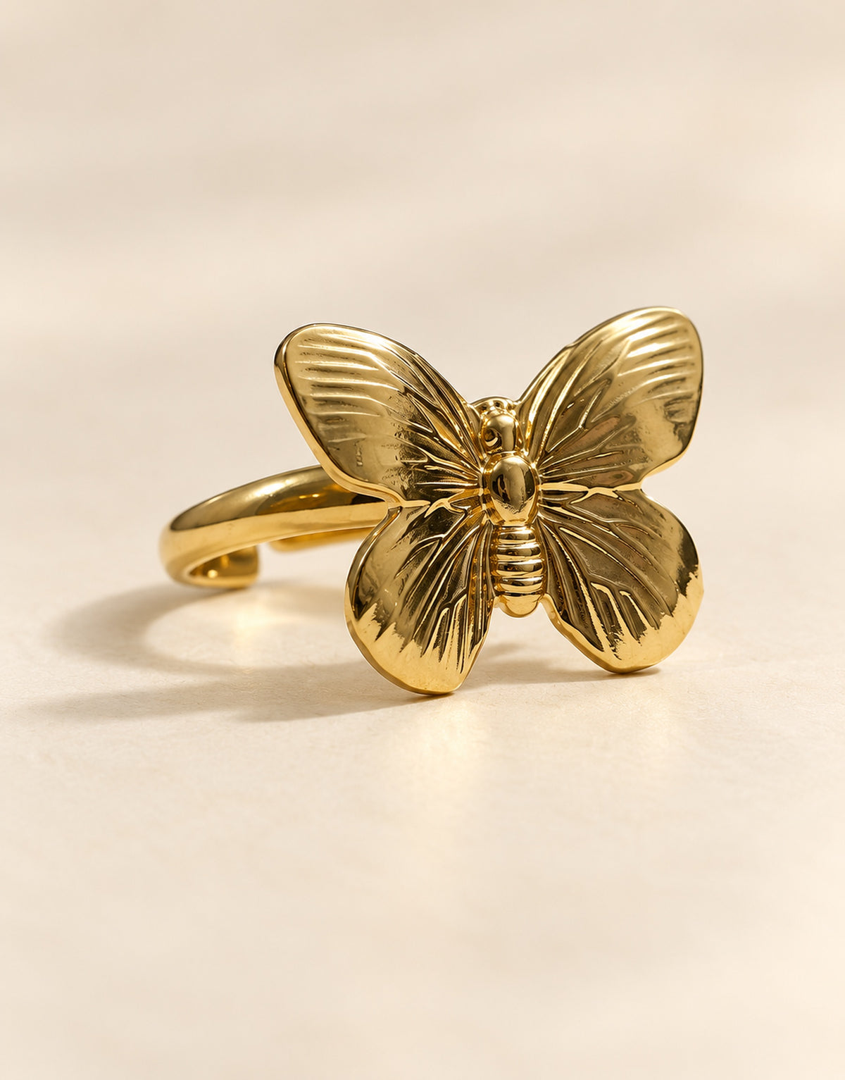 Orneza Gold-Tone Ribbed Wing Butterfly Ring — angle view