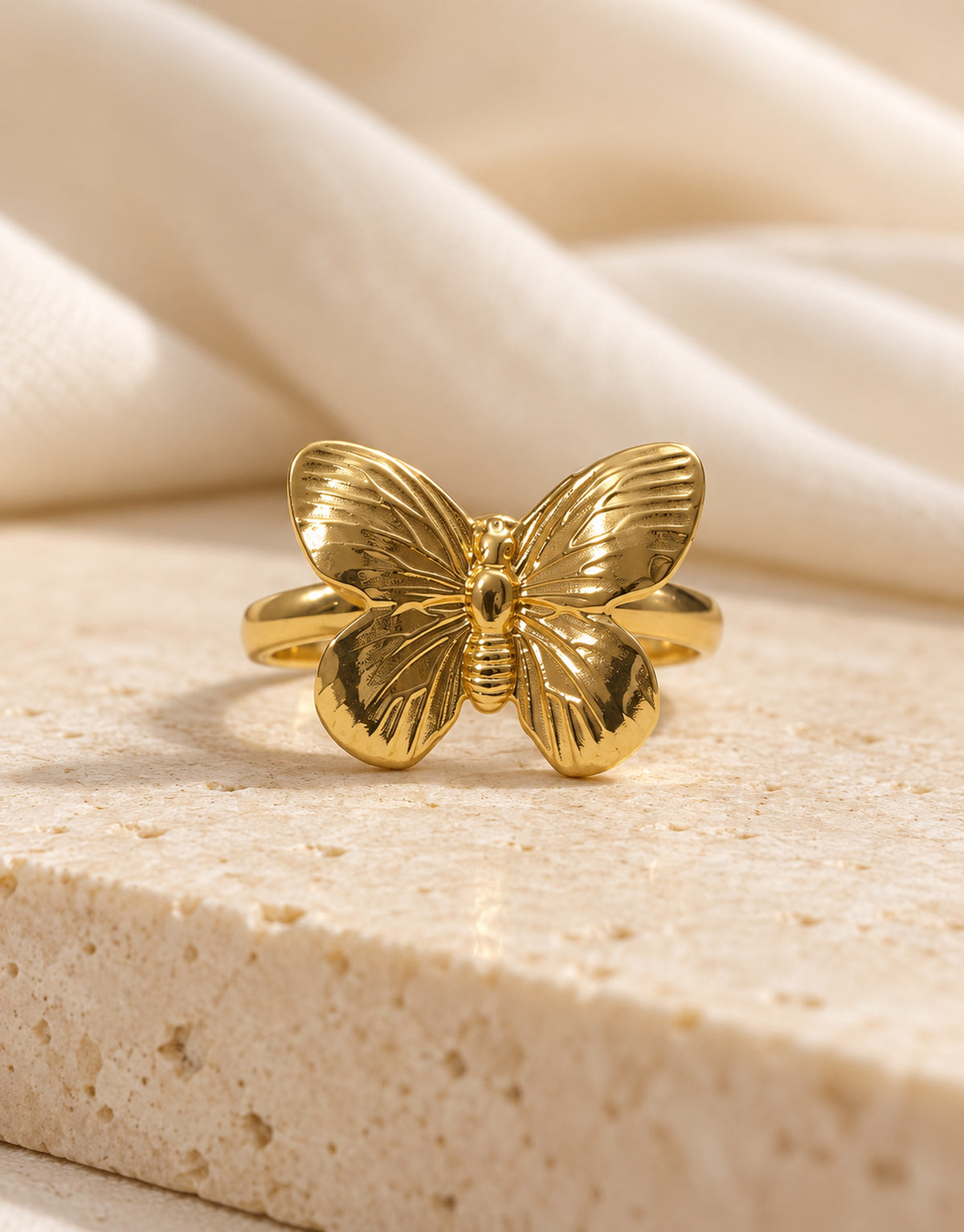 Orneza Gold-Tone Ribbed Wing Butterfly Ring — styled view
