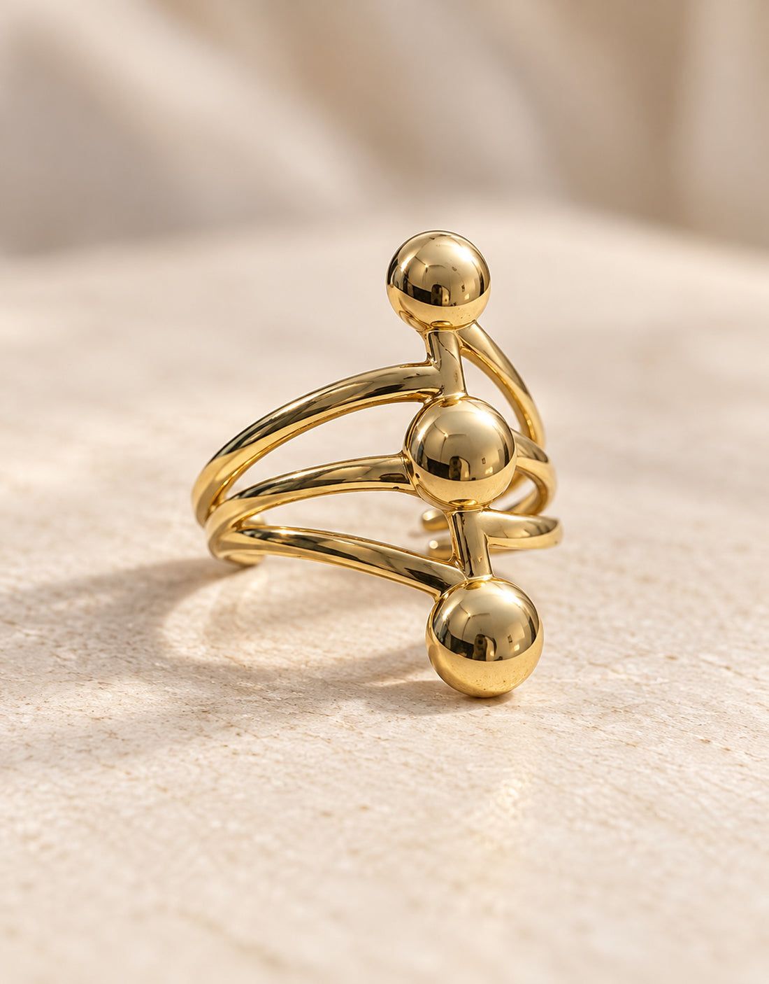 Orneza Gold-Tone Three Ball Stacked Ring — angle view