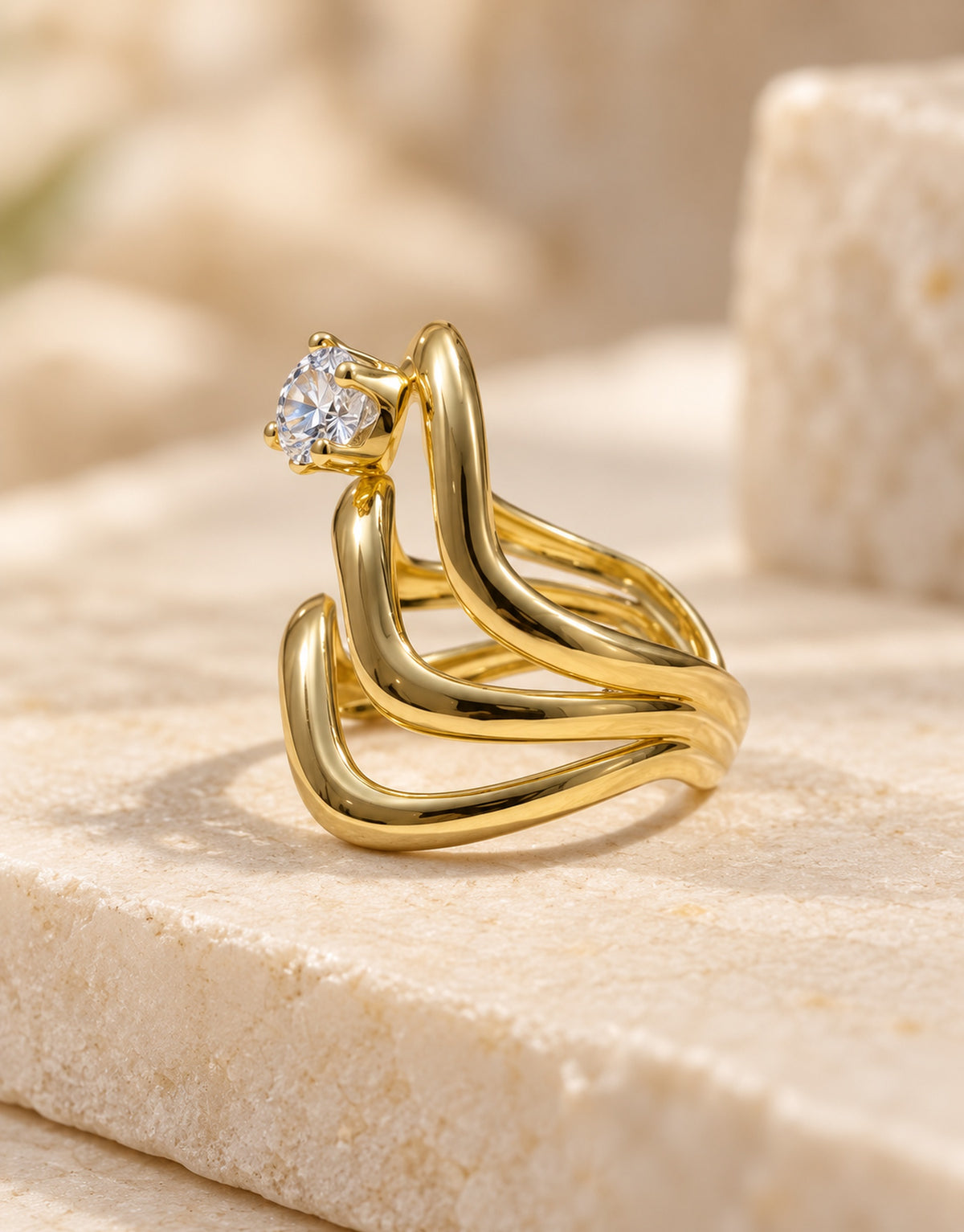 Orneza Gold-Tone Wavy Stacked Clear Stone Ring — angle view