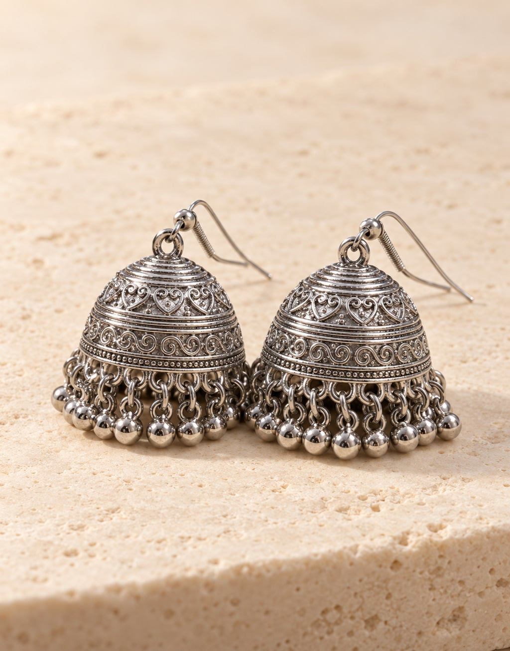 Orneza Silver-Tone Engraved Bell Jhumka Earrings — front view