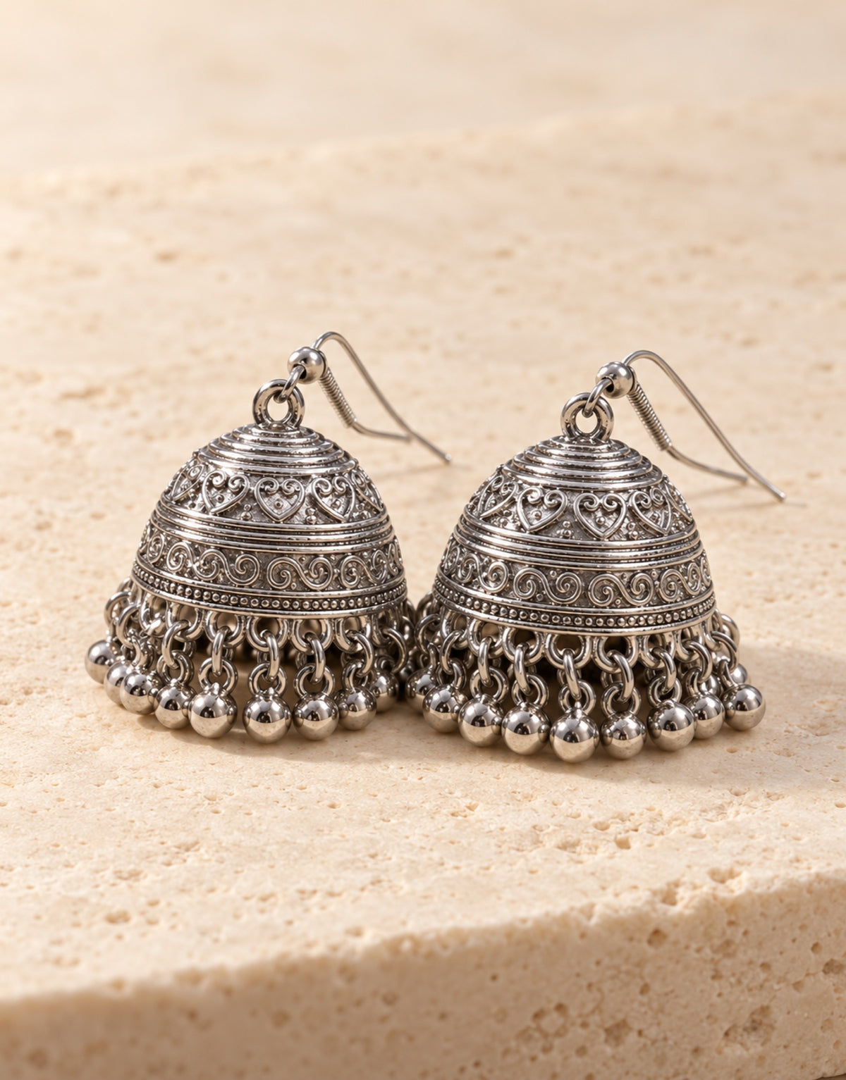 Orneza Silver-Tone Engraved Bell Jhumka Earrings — front view