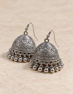 Orneza Silver-Tone Engraved Bell Jhumka Earrings — angle view