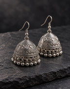 Orneza Silver-Tone Engraved Bell Jhumka Earrings — styled view