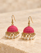 Orneza Fuchsia Dotted Enamel Jhumka Earrings with Pearls — front view