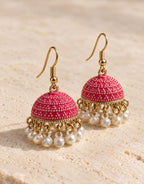 Orneza Fuchsia Dotted Enamel Jhumka Earrings with Pearls — angle view