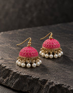 Orneza Fuchsia Dotted Enamel Jhumka Earrings with Pearls — styled view