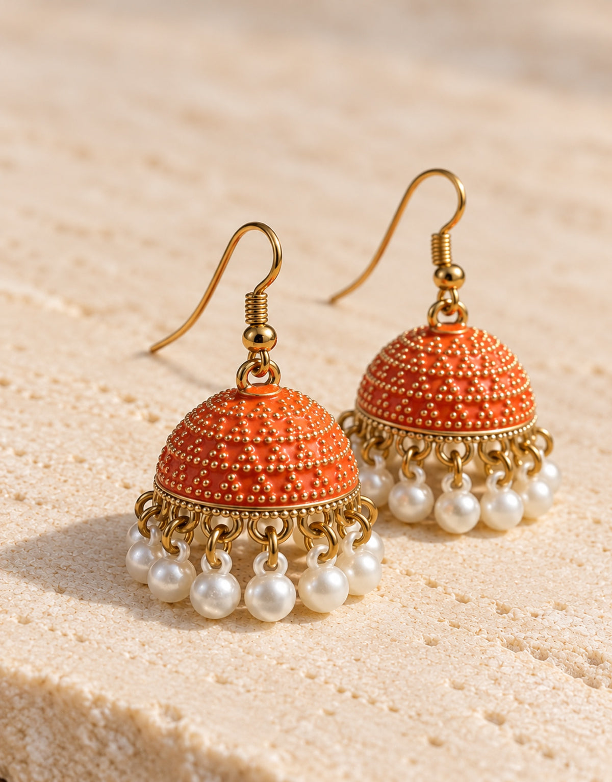 Orneza Orange Dotted Enamel Jhumka Earrings with Pearls — angle view