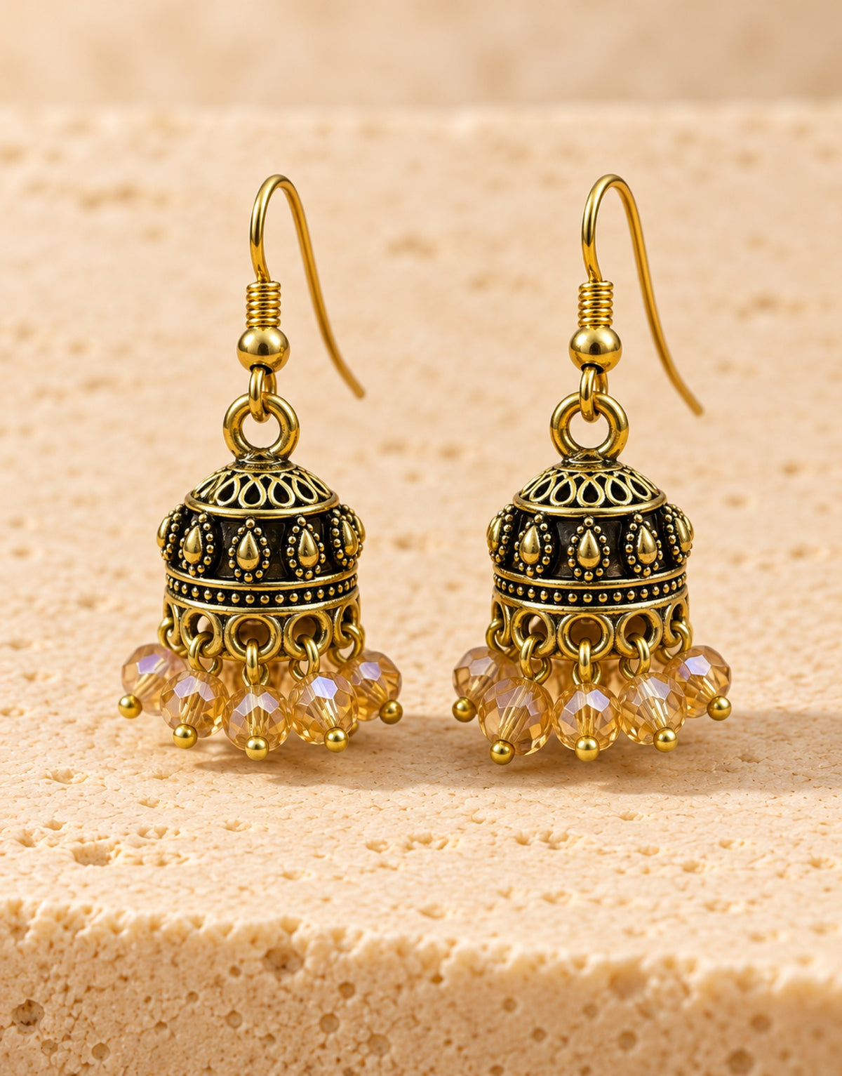 Orneza Antique Gold-Tone Mini Jhumka Earrings with Champagne Beads — front view