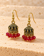 Orneza Antique Gold-Tone Mini Jhumka Earrings with Red Beads — angle view