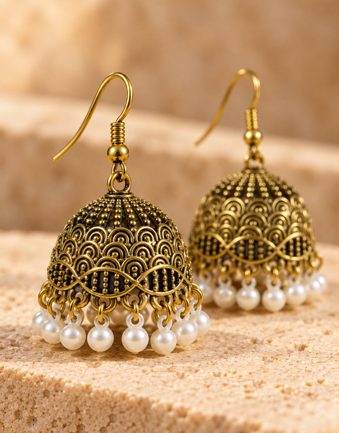 Orneza Antique Gold-Tone Scallop Pattern Jhumka Earrings with Pearls — close-up detail