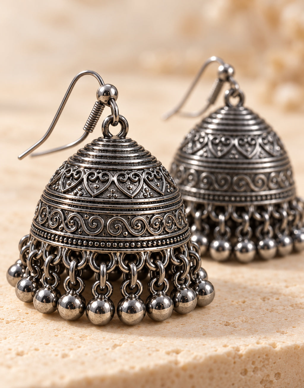 Orneza Dark Oxidised Engraved Bell Jhumka Earrings — close-up detail