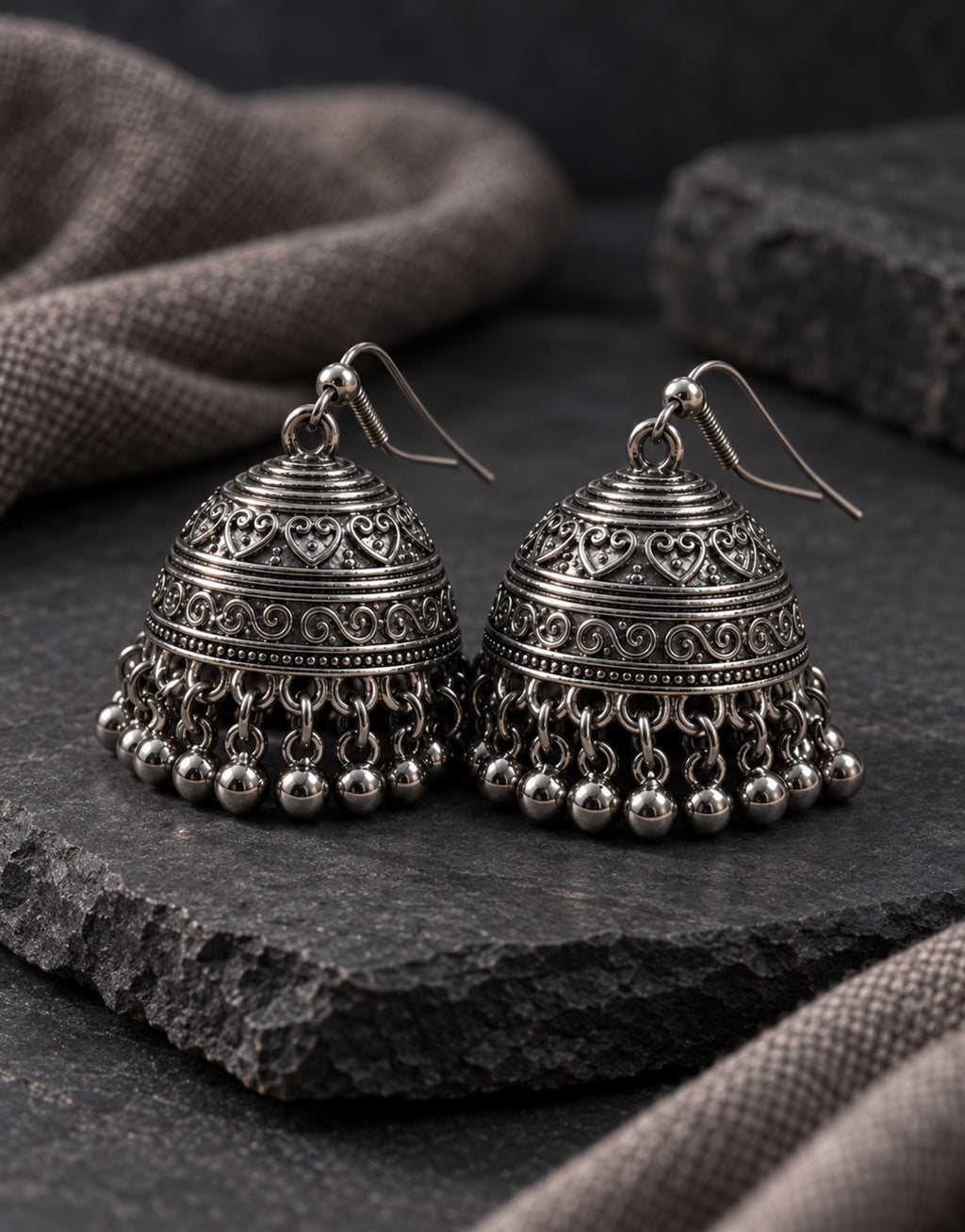 Orneza Dark Oxidised Engraved Bell Jhumka Earrings — styled view
