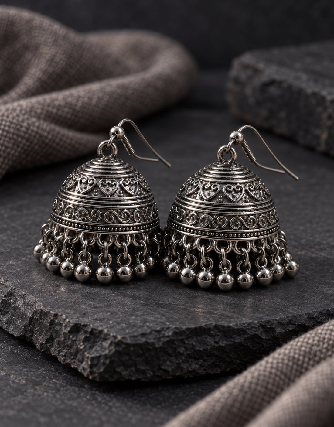 Orneza Dark Oxidised Engraved Bell Jhumka Earrings — styled view