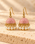 Orneza Pastel Pink Dotted Enamel Jhumka Earrings with Pearls — front view