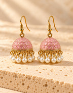 Orneza Pastel Pink Dotted Enamel Jhumka Earrings with Pearls — front view