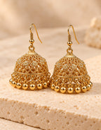 Orneza Gold-Tone Floral Lattice Jhumka Earrings with Gold Beads — angle view