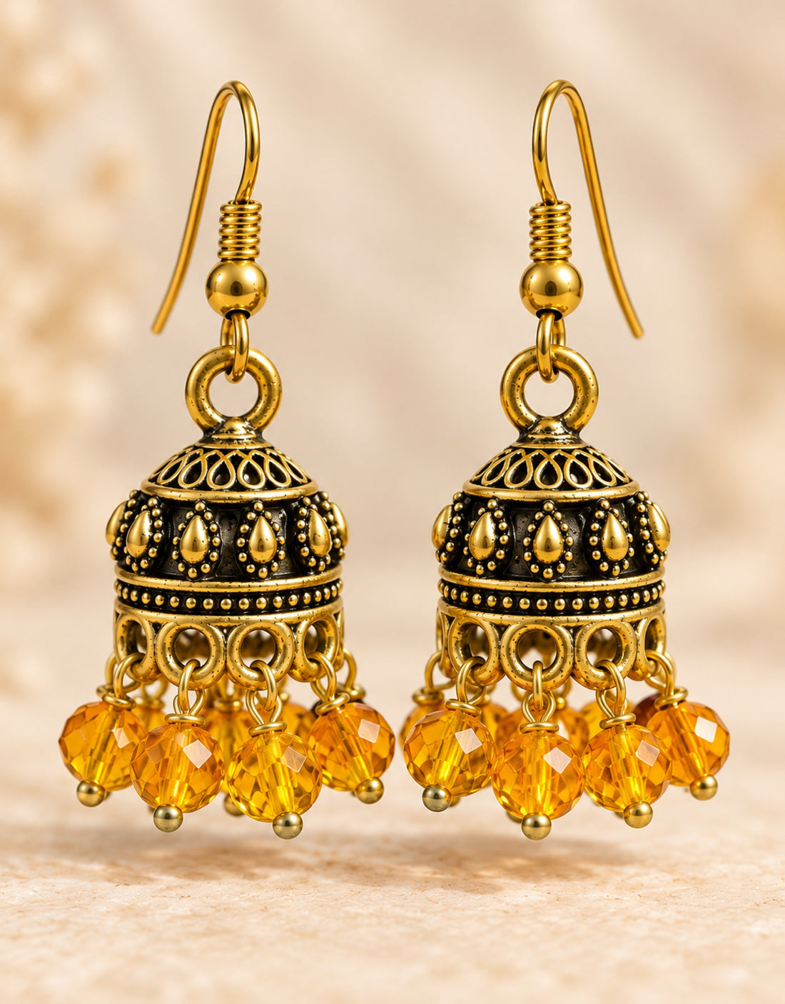 Orneza Antique Gold-Tone Mini Jhumka Earrings with Amber Beads — close-up detail