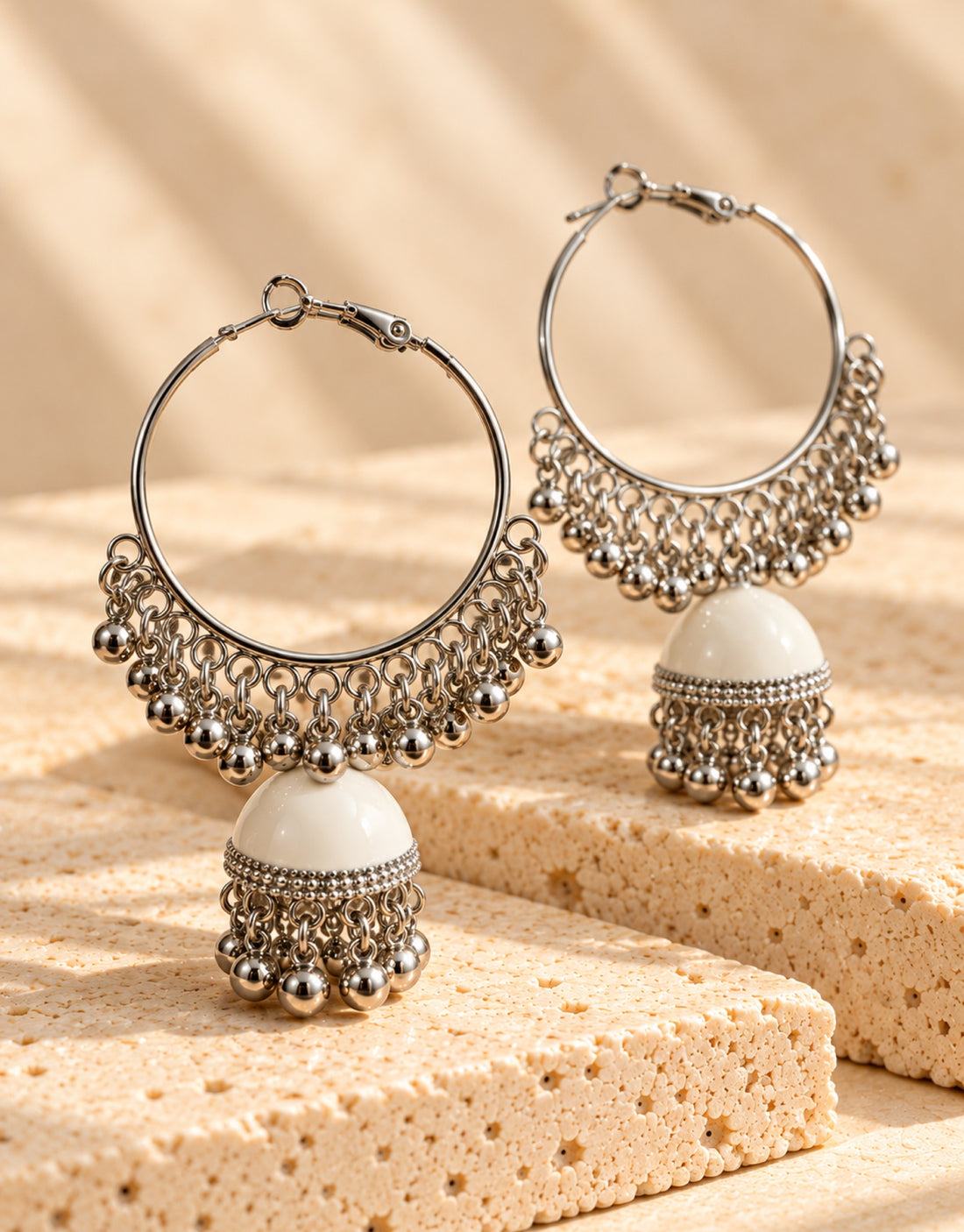 Orneza Silver-Tone Hoop Jhumka Earrings in White — angle view